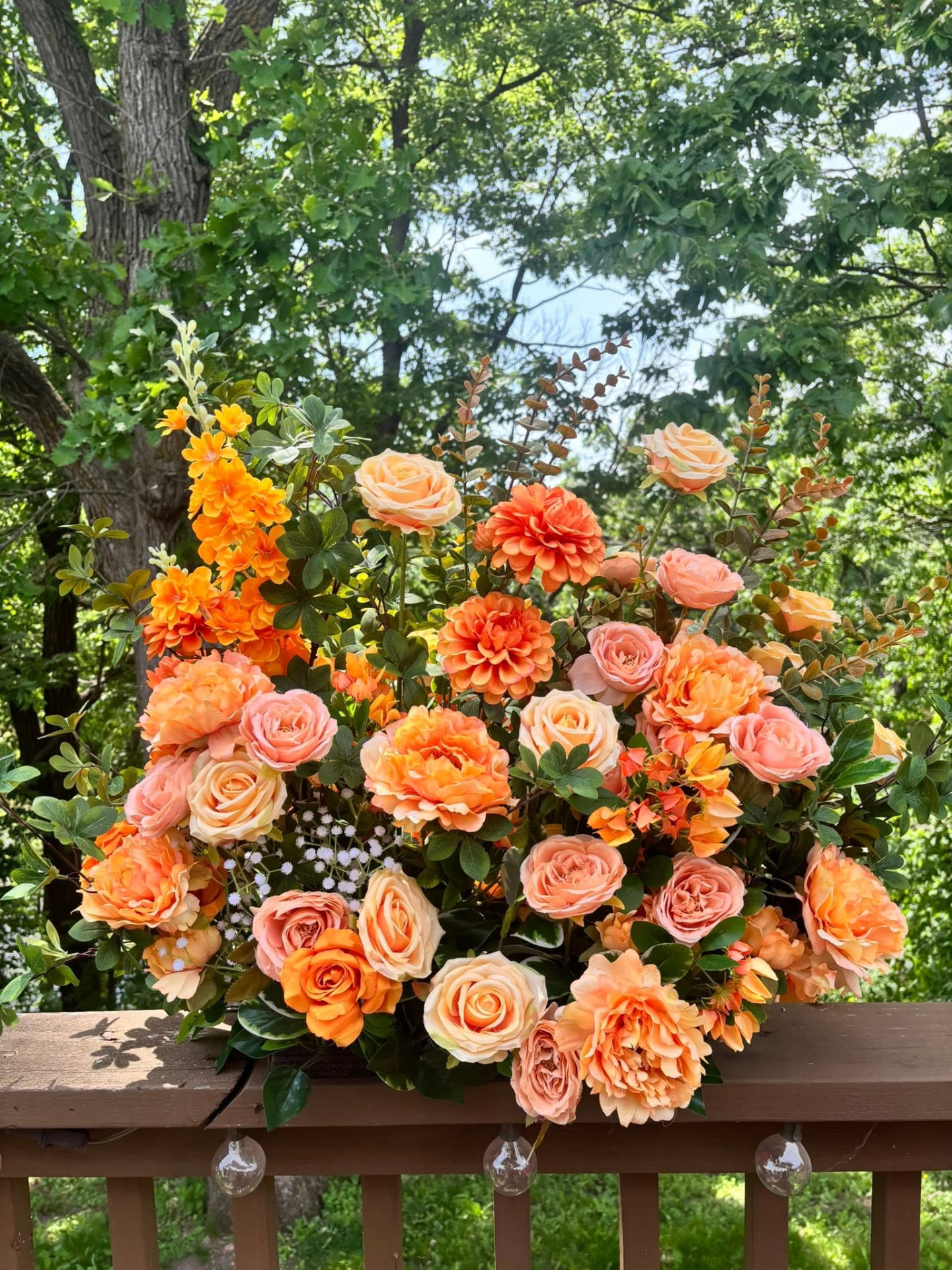 Coral and orange faux floral arrangement