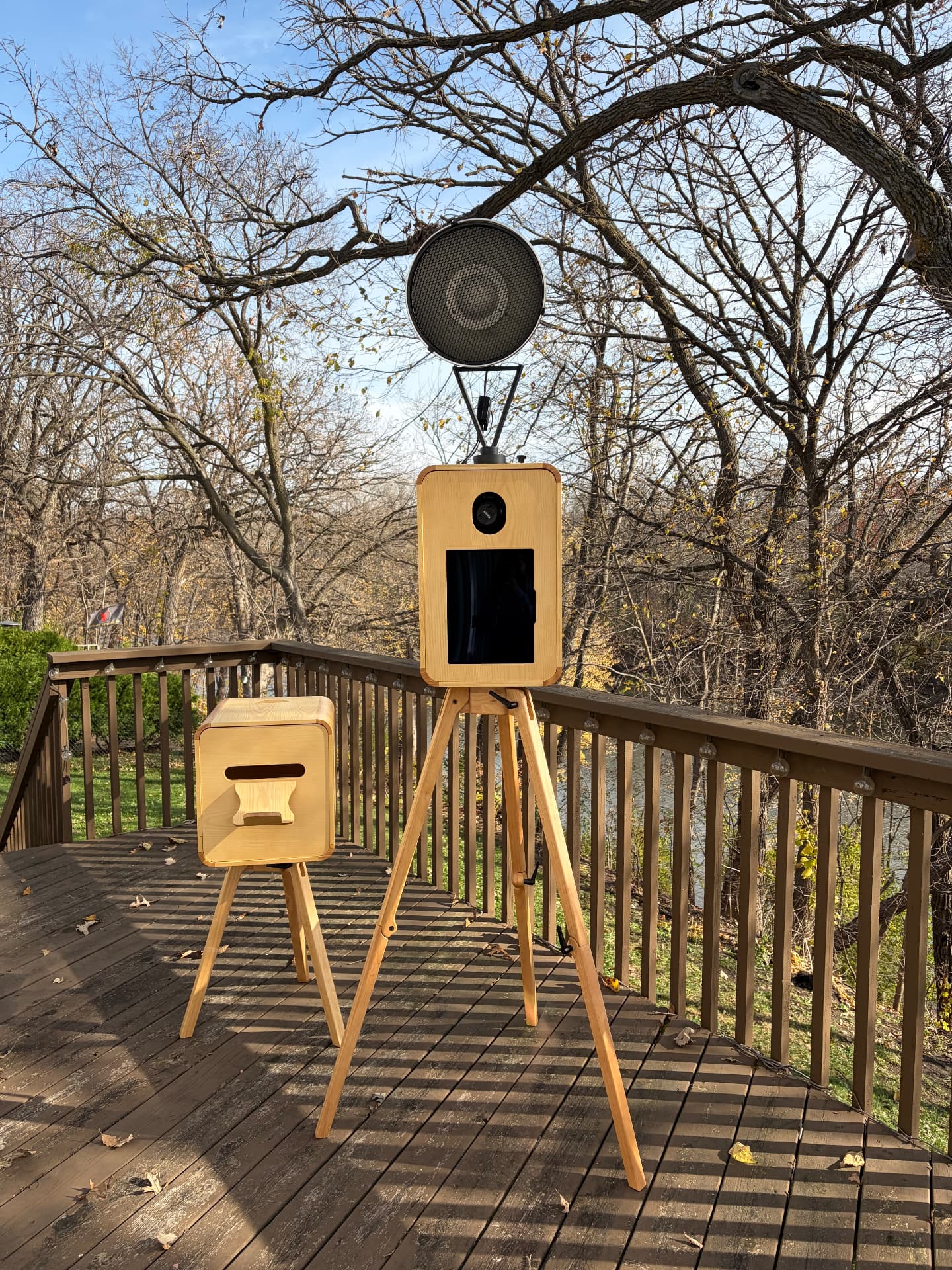 Severance’s wooden open-air photo booth and matching print station on a deck